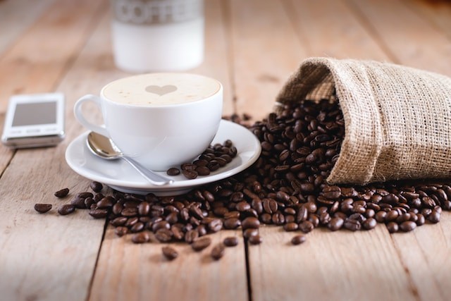 coffee beans with coffee cup on the table