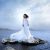 person in wedding dress near the sea