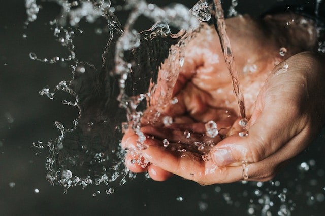 water in persons hands
